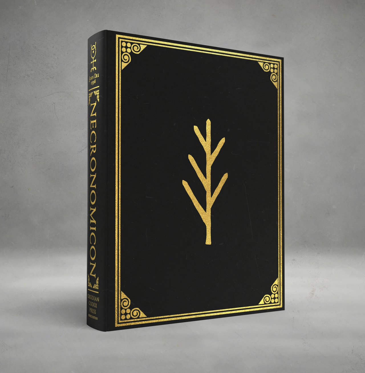 Black book with gold trim and symbol on a gray background