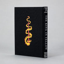 Back board of the King in Yellow Artefact Edition featuring Chambers' Yellow Sign in silver foil on black cloth.