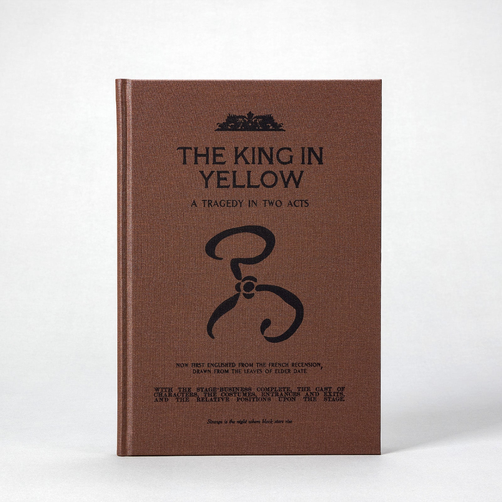 Companion volume — The King in Yellow: A Tragedy in Two Acts, a kraft-wrapped theatre booklet styled after late 19th-century printings.