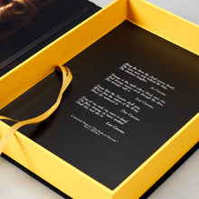 Interior of the Artefact Edition clamshell case — Cassilda's Song in white on black, with the Stranger figure by Arturo Velasco below.