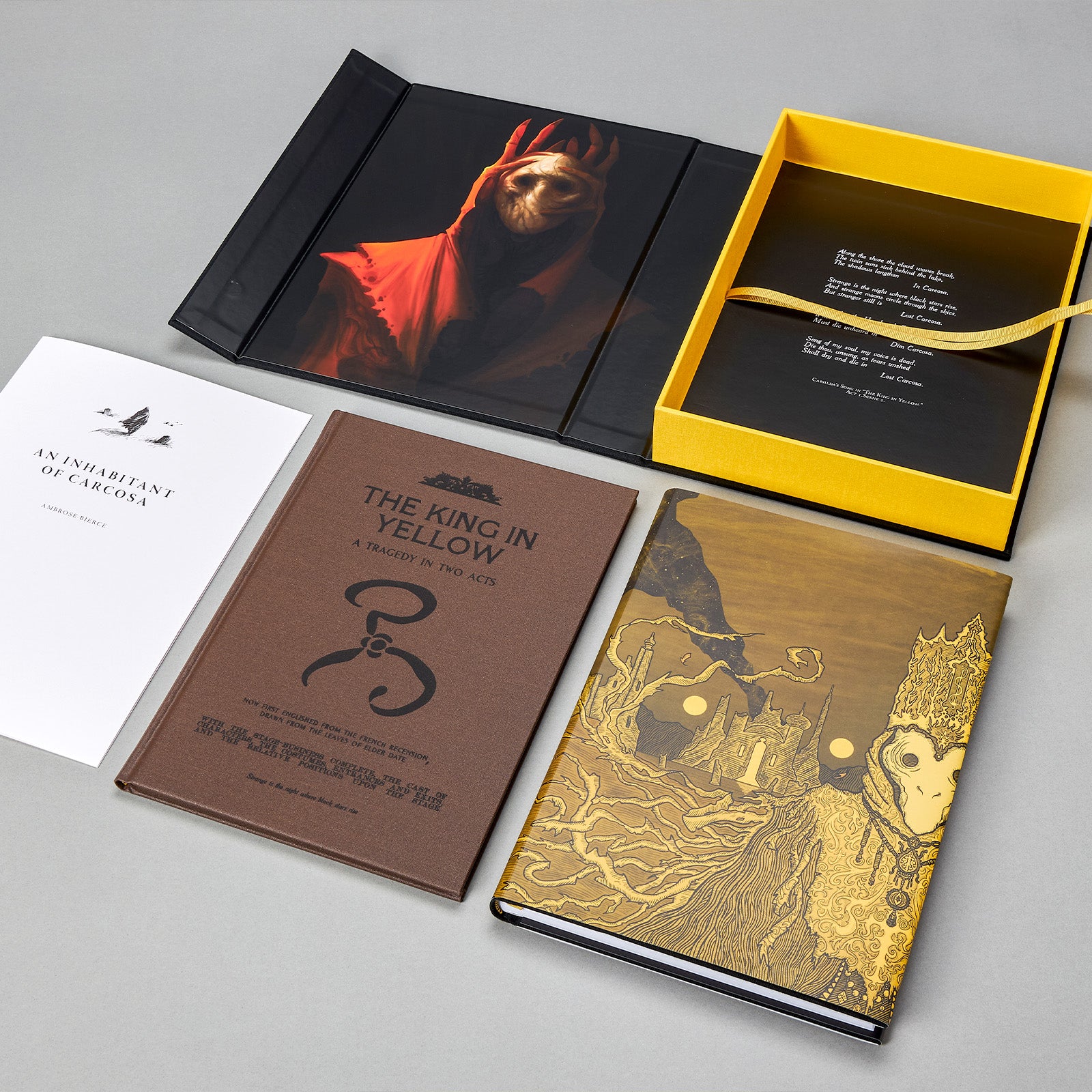 Alternate view of the King in Yellow Artefact Edition set: clamshell case, Carcosa pamphlet, book in dust-jacket, and accompanying play volume.