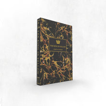 Book titled 'The King in Yellow' with black and gold design on a white background