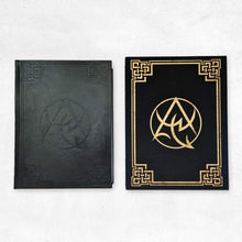 The Necronomicon Artifact Edition book (black PU leather with debossed border) and slipcase (black cloth with gold foil Necronomicon emblem and border)